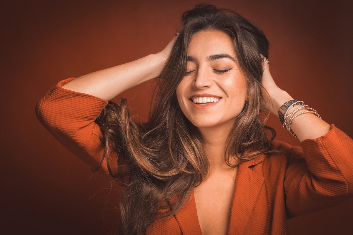 woman-running-hands-through-hair